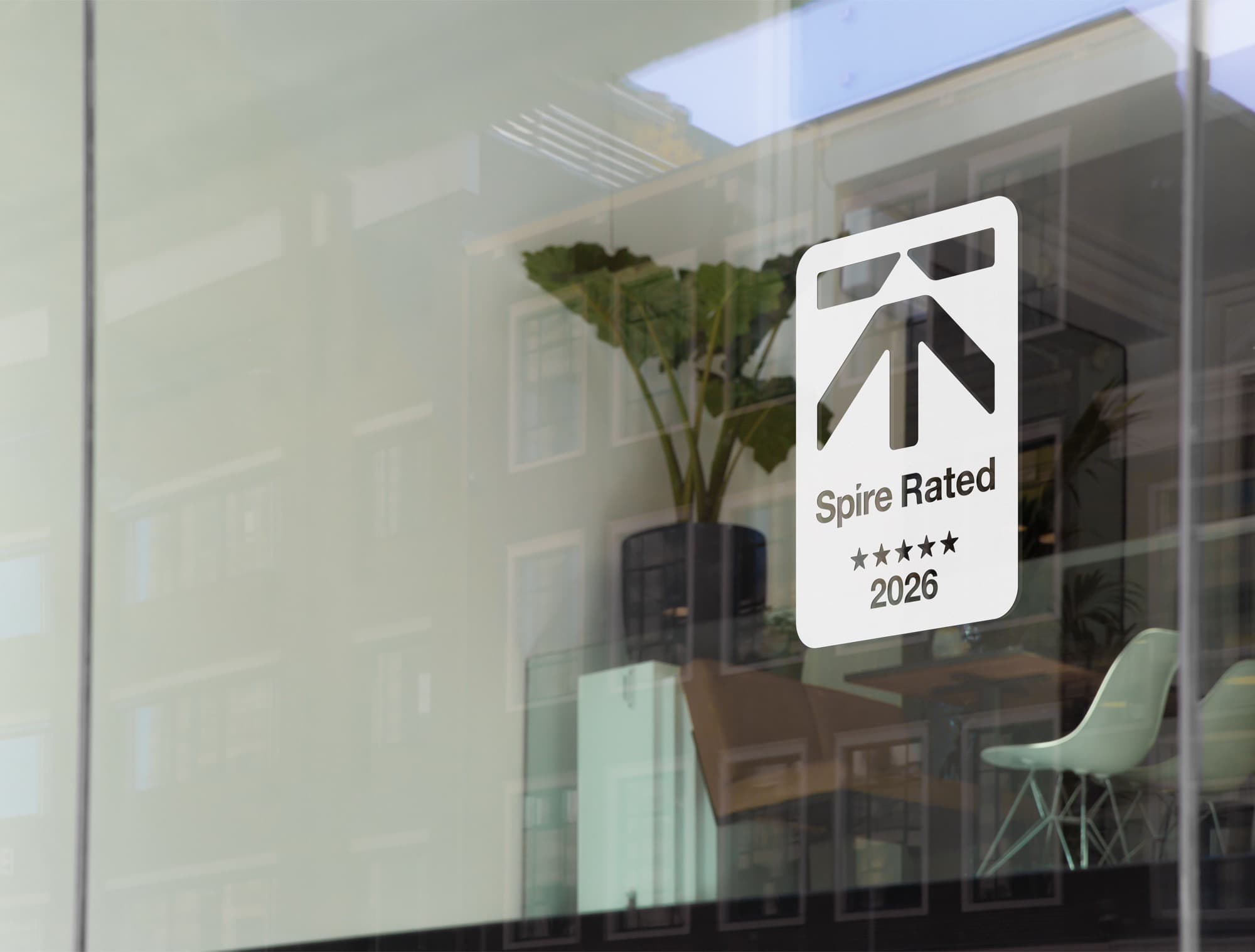 The Spire Rated window sticker on a building's glazing.